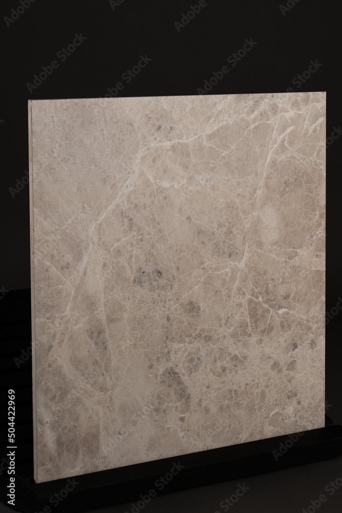 Porcelain tiles with a stone texture on a dark gray background Porcelain tiles with a stone texture on a dark gray background
