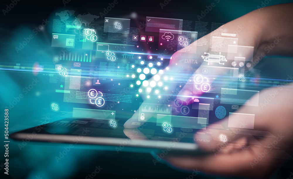 Close-up of a hand using tablet, currency concept