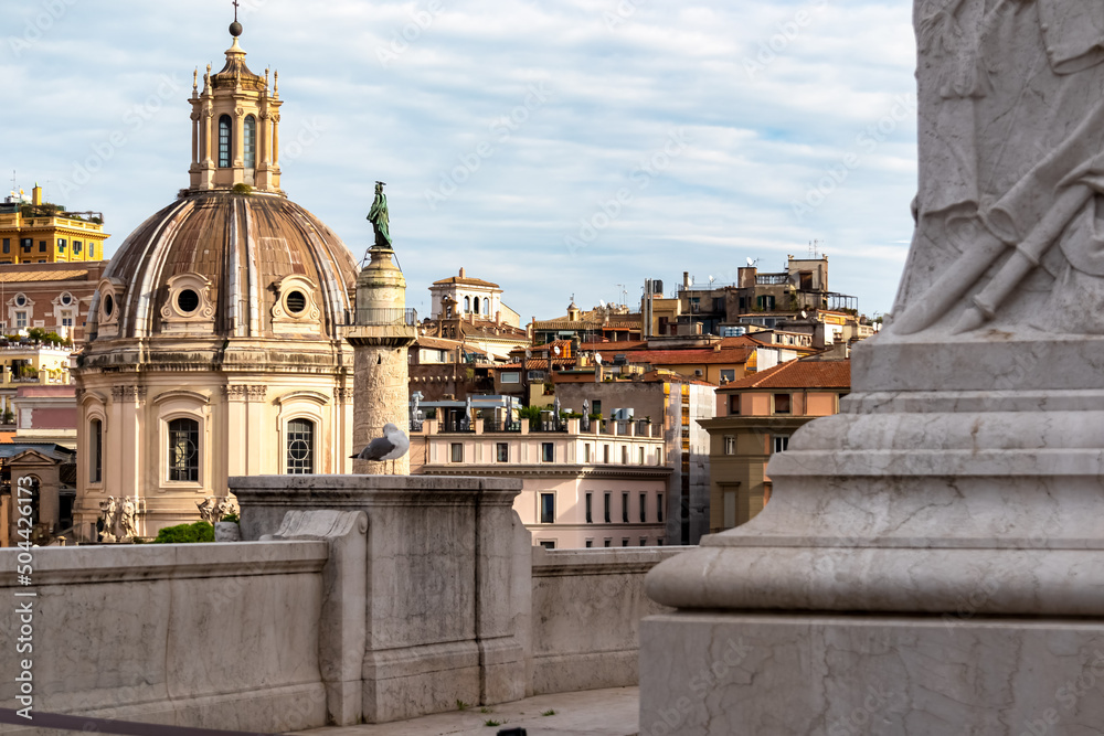 Fototapeta premium View Victor Emmanuel II monument at Piazza Venezia on dome of the Santa Maria di Loreto church and dome of Most Holy Name of Mary at Trajan Forum. Landmark in the city of Rome, Lazio, Italy, Europe