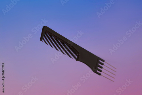 Professional tools from a beauty salon on a pink blurred background