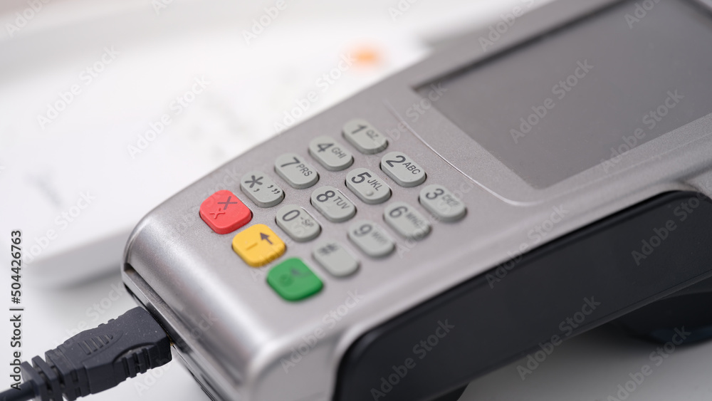 POS terminal for payment with wire closeup POS terminal for payment with wire closeup