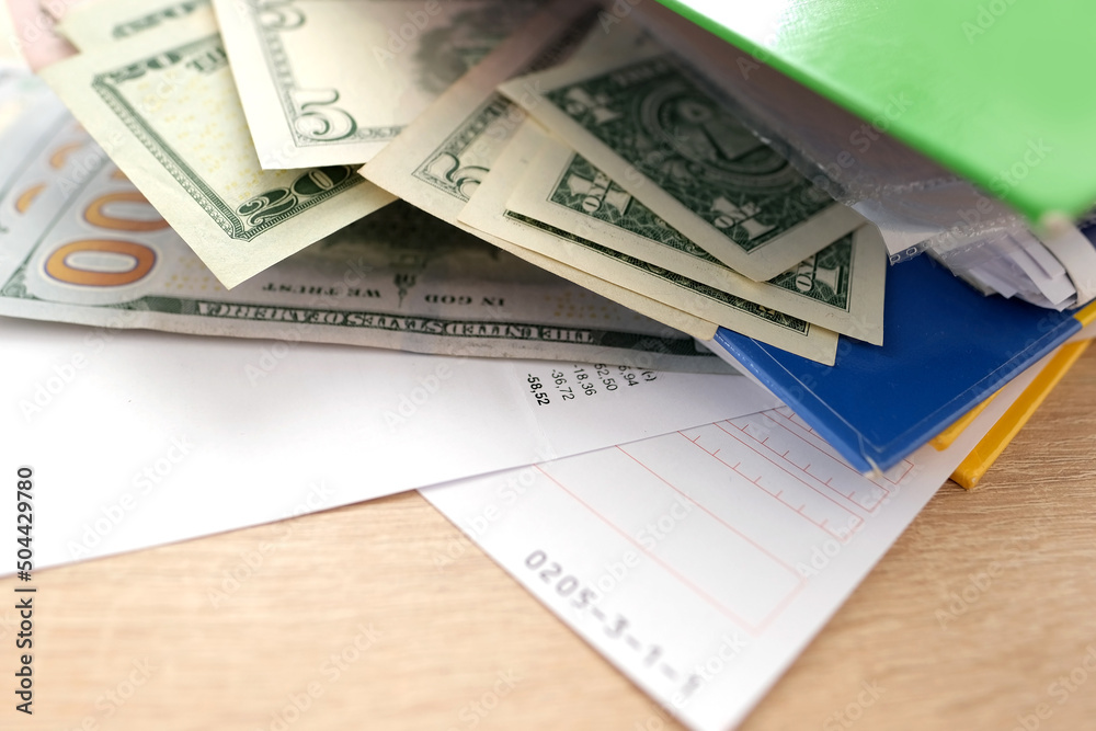 office folders close-up, american dollars banknotes, concept of filling out tax return, paying taxes, Corporate business income, expenses, maintaining household expenses, Gearing Up for Startups office folders close-up, american dollars banknotes, concept of filling out tax return, paying taxes, Corporate business income, expenses, maintaining household expenses, Gearing Up for Startups