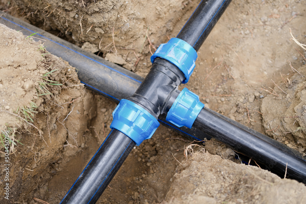© megaflopp - Installed PVC water pipes in trench at construction site © megaflopp - Installed PVC water pipes in trench at construction site