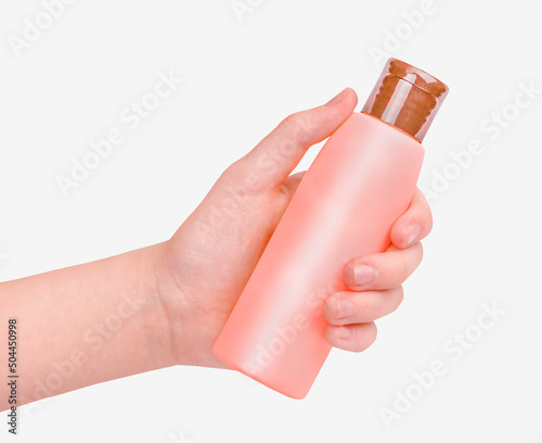 A hand holding sunscreen cream isolated on white background