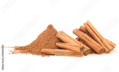 Ceylon cinnamon sticks and pile of ground cinnamon isolated on a white background