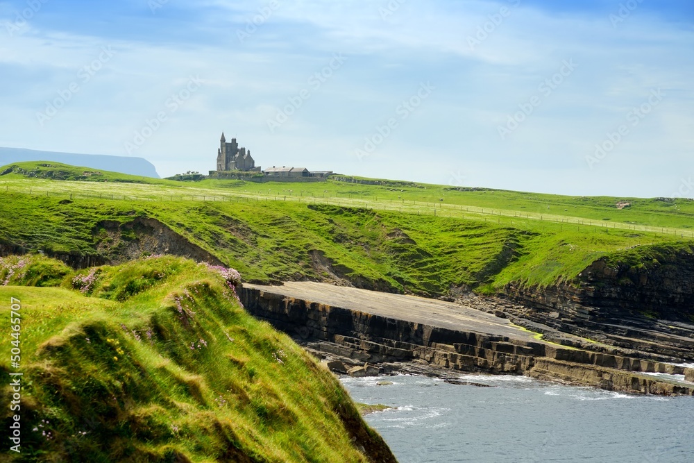 Spectacular view of Mullaghmore Head with huge waves rolling ashore. Picturesque scenery with magnificent Classiebawn Castle. Signature point of the Wild Atlantic Way, Ireland