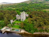 Aerial view of Glenveagh Castle, a large castellated mansion located in Glenveagh National Park.
