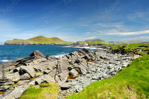 Beautiful view of Valentia Island Lighthouse at Cromwell Point. Locations worth visiting on the Wild Atlantic Way. Scenic Irish countyside on sunny summer day, Ireland photo