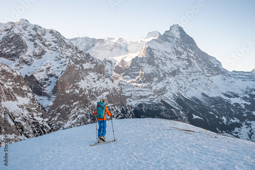 Woman ski touring in the alps of Switzerland photo