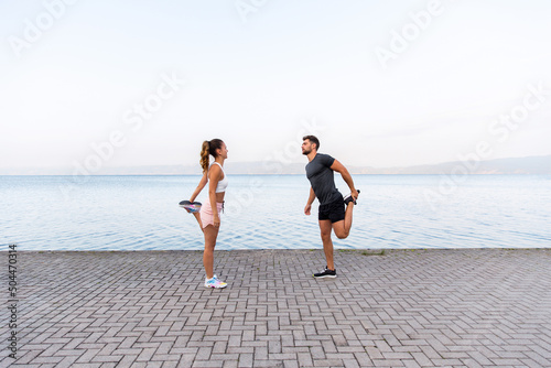 Couple Stretching Before Their Workout photo