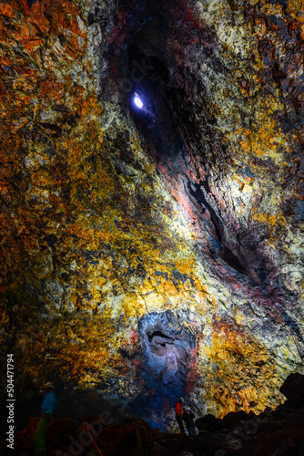 Tourists and guides inside the colorful caldera of Thríhnúkagígur volcano, southwest Iceland photo