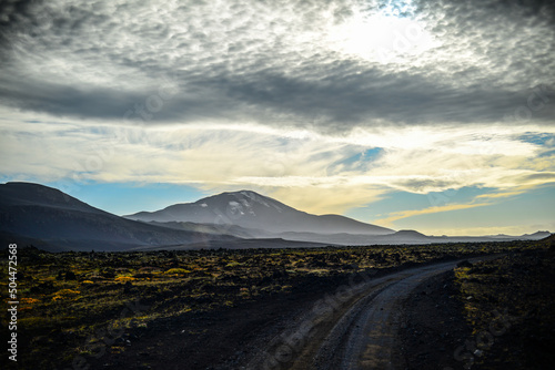 The imposing Hekla stratovolcano, one of Iceland's most active volcanoes, seen from the rough road to Landmannalaugar through the bleak volcanic landscape of the Central Highlands of Iceland