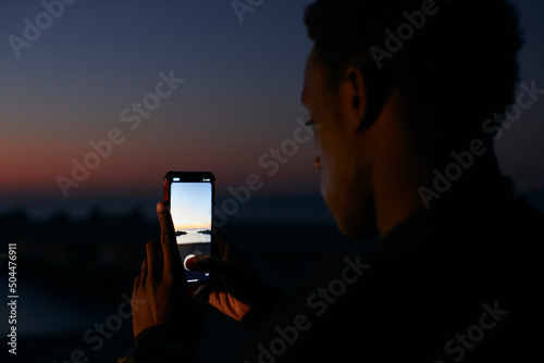 Two friends hang out on the beach photo