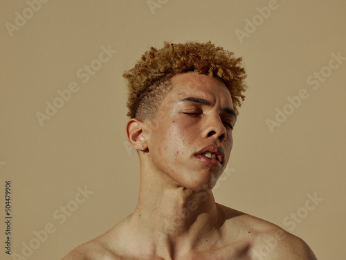 relaxed  portrait - sunlight - afro red hair - earth tones  photo