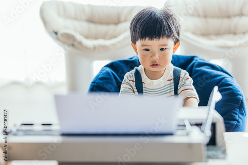 boy typing on a typewriter