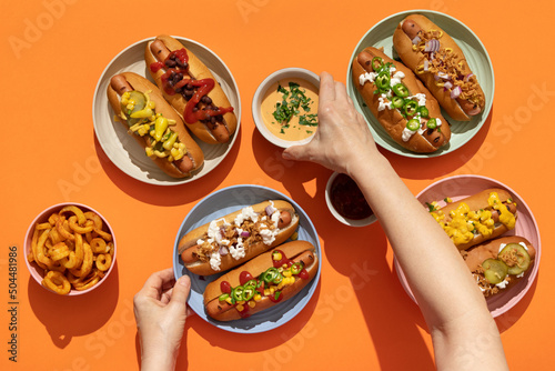 Finger food: grilled hot dogs with condiments and toppings