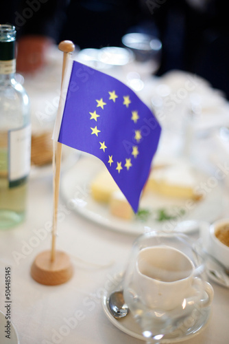 A small EU flag on a lunch table photo