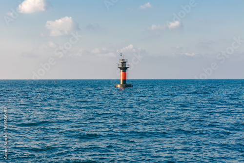 A beacon in the middle of the sea. photo