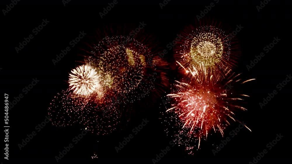 Colorful Firework Displays lighting up the sky at night in Slow Motion