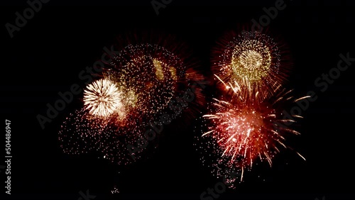 Colorful Firework Displays lighting up the sky at night in Slow Motion photo