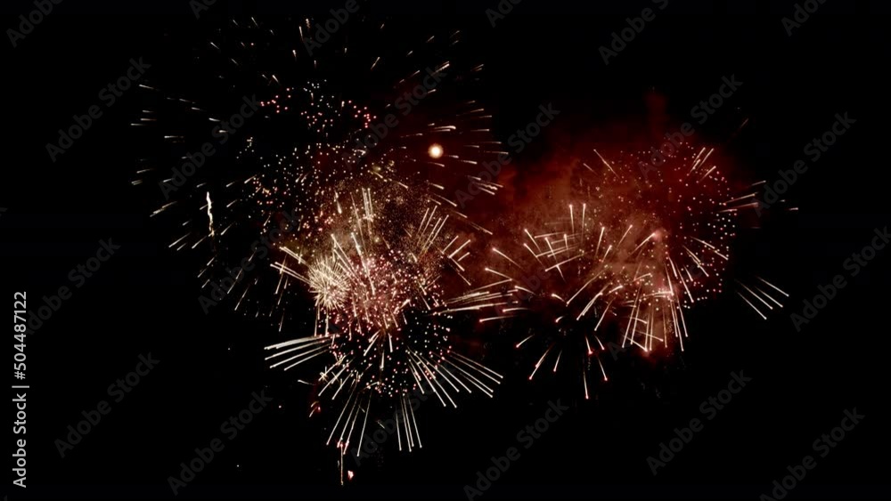 Colorful Firework Displays lighting up the sky at night in Slow Motion