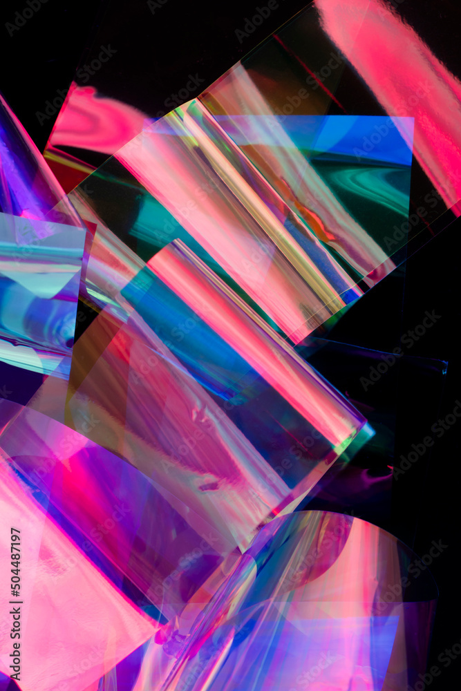 Closeup of neon holographic foils on black Closeup of neon holographic foils on black
