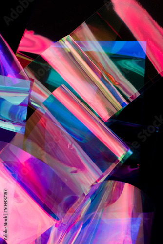 Closeup of neon holographic foils on black