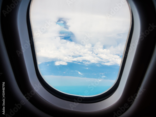 Beautiful Stratocumulus clouds view by looking through an airplane window.