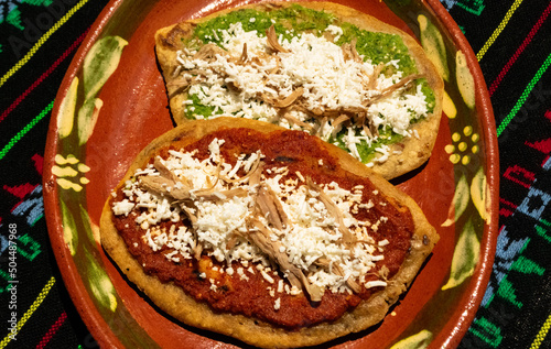 Gastronomic icons in Mexico known as Tlacoyos with green and red sauce photo