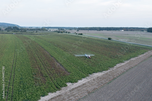 Tractor spraying filed photo