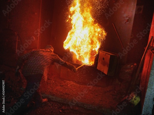 A worker at a coal-fired heating plant
