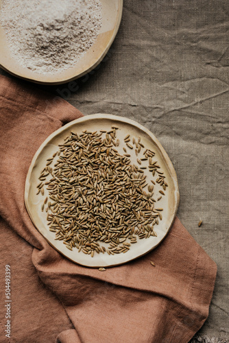 Freshly milled rye flour and rye berries photo