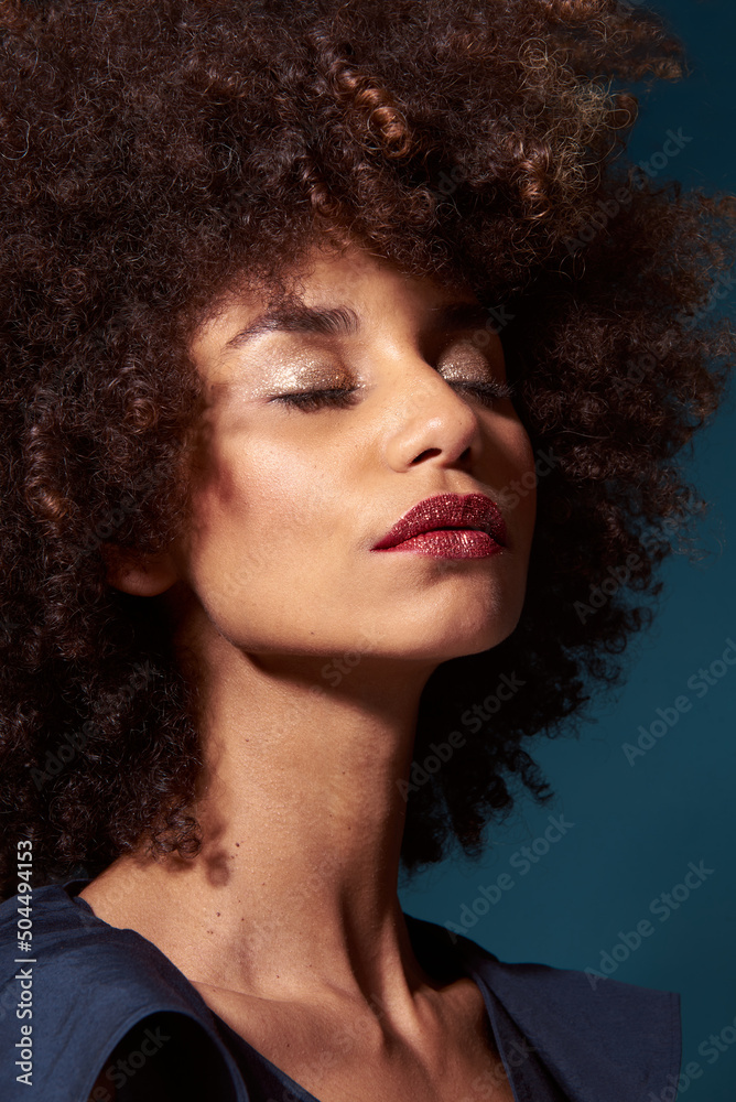 Beauty shot of a Relaxed Afro-american young woman Beauty shot of a Relaxed Afro-american young woman