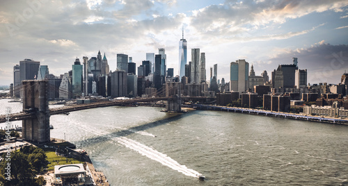 Drone view of Manhattan, New York City and Brooklyn bridge at sunset photo