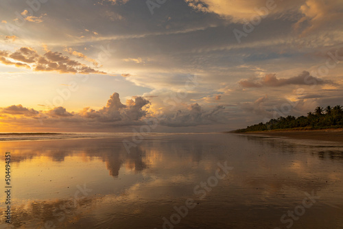 Stunning Sunset at beach with sky reflection in Costa Rica photo