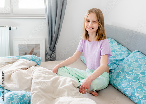 Little girl in bedroom photo