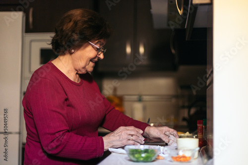 Grandmother cooking at home