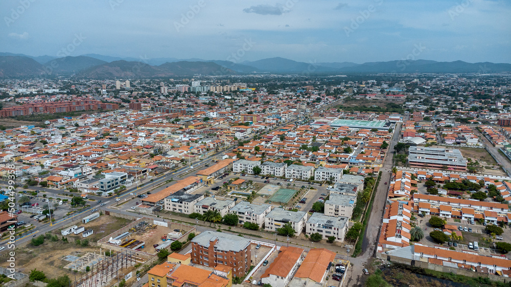 aerial drone shots of the beach city of Lechería, with a residential area of Venice-style stilt houses, you can see houses, editions, canals, houses on the sea, stilt houses, parking lots, swimming po