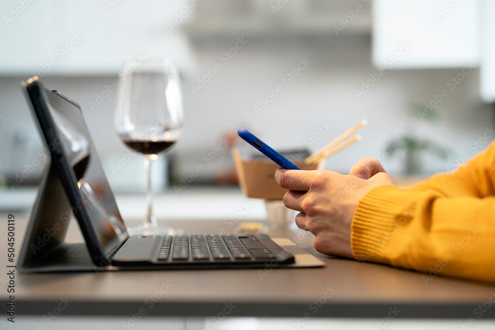 Crop woman browsing smartphone at home Crop woman browsing smartphone at home