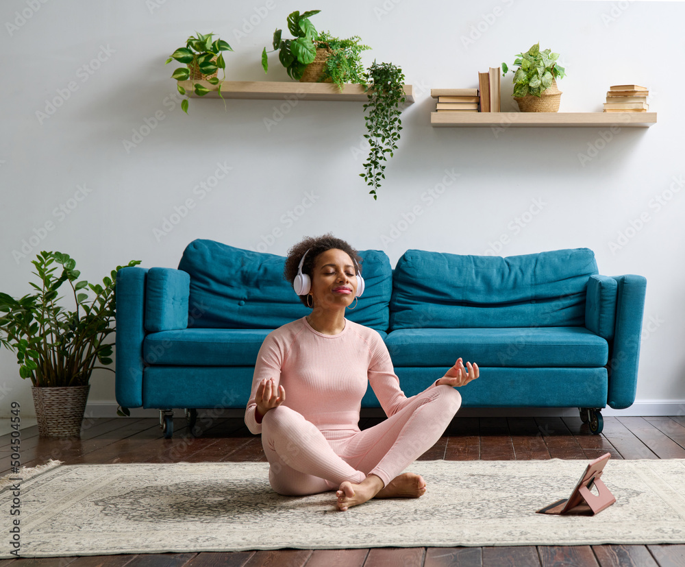Woman meditating at home Woman meditating at home
