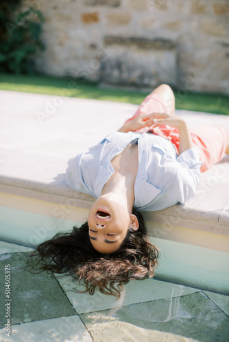 Woman With Floating Hair In Pool Water