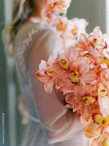 Woman With Bouquet Of Flowers photo