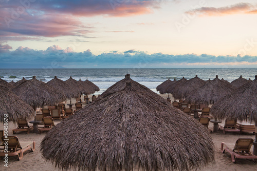 Beach Palapas Ocean with Sunset