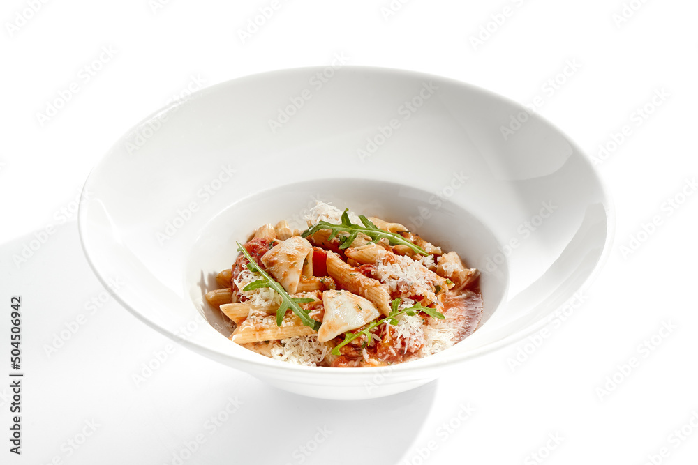Traditional Italian dish - penne with salmon and squid with tomato sauce and olives. Penne marinara with seafood on white table. Italian seafood pasta in arrabiata sauce - healthy mediterrian lunch. Traditional Italian dish - penne with salmon and squid with tomato sauce and olives. Penne marinara with seafood on white table. Italian seafood pasta in arrabiata sauce - healthy mediterrian lunch.