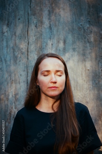 A woman with closed eyes photo