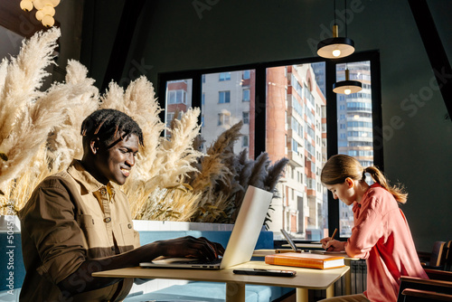 Multiracial freelancers in coworking space photo