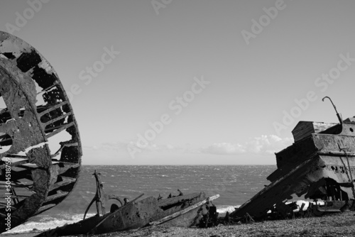 remains of an old ship on the beach photo