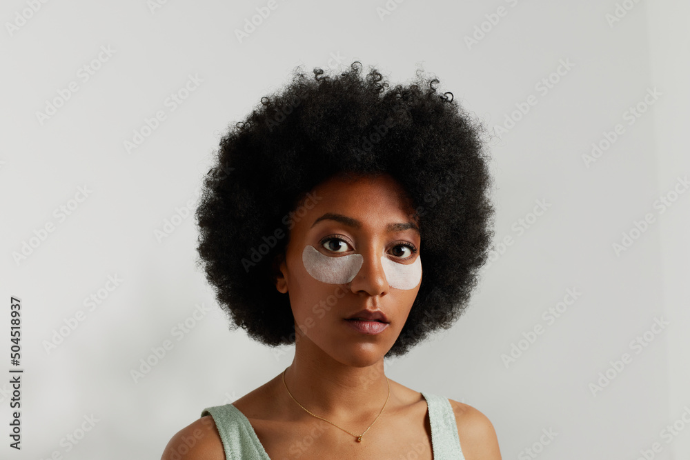 African American woman with cosmetic patches on face African American woman with cosmetic patches on face