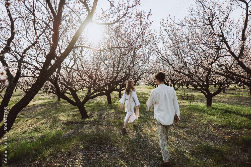 man and woman walking in the garden man and woman walking in the garden