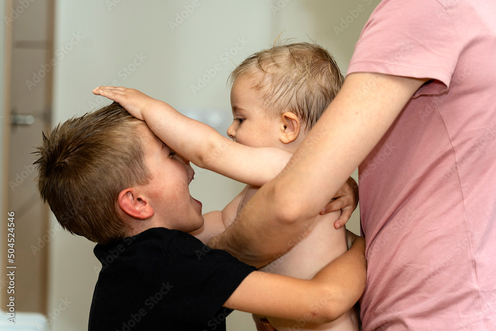 Brother playing with cute naked baby Brother playing with cute naked baby